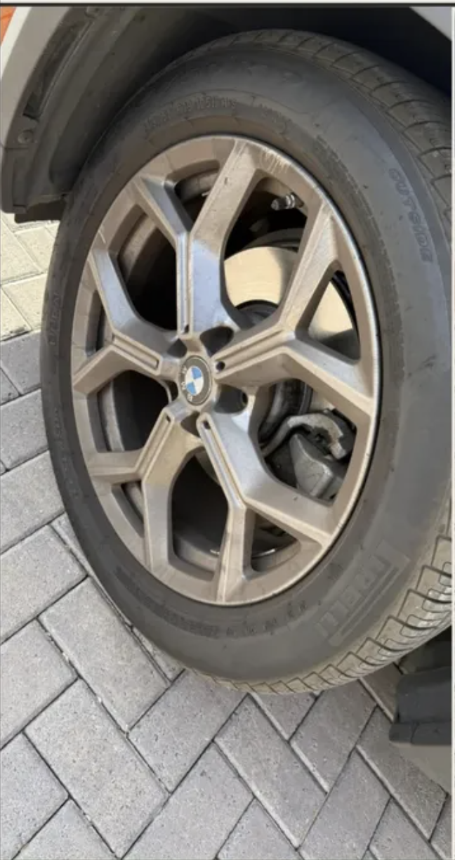 BMW wheel with heavy brake dust decontaminated to a mirror finish — before detailing