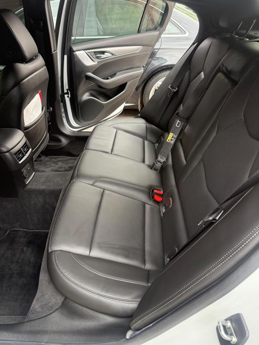 Cadillac CT5 rear seat and door sill cleaned during an interior detail