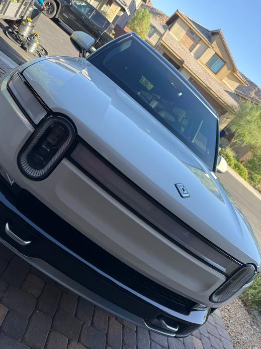 White Rivian R1S front end washed and sealed in a Las Vegas driveway