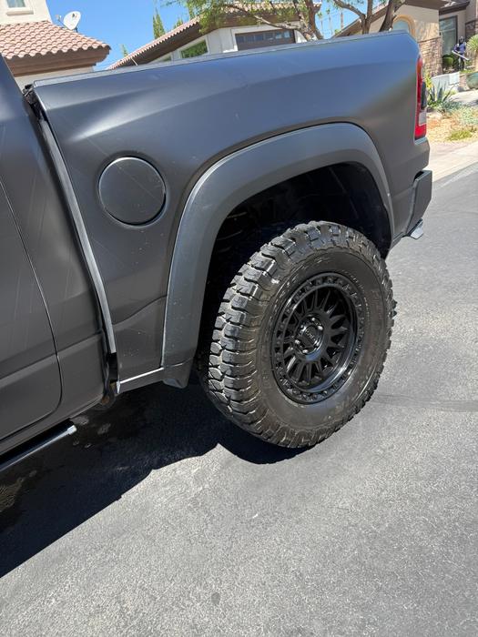 GMC Sierra rear wheel arch and tire after a full truck wash